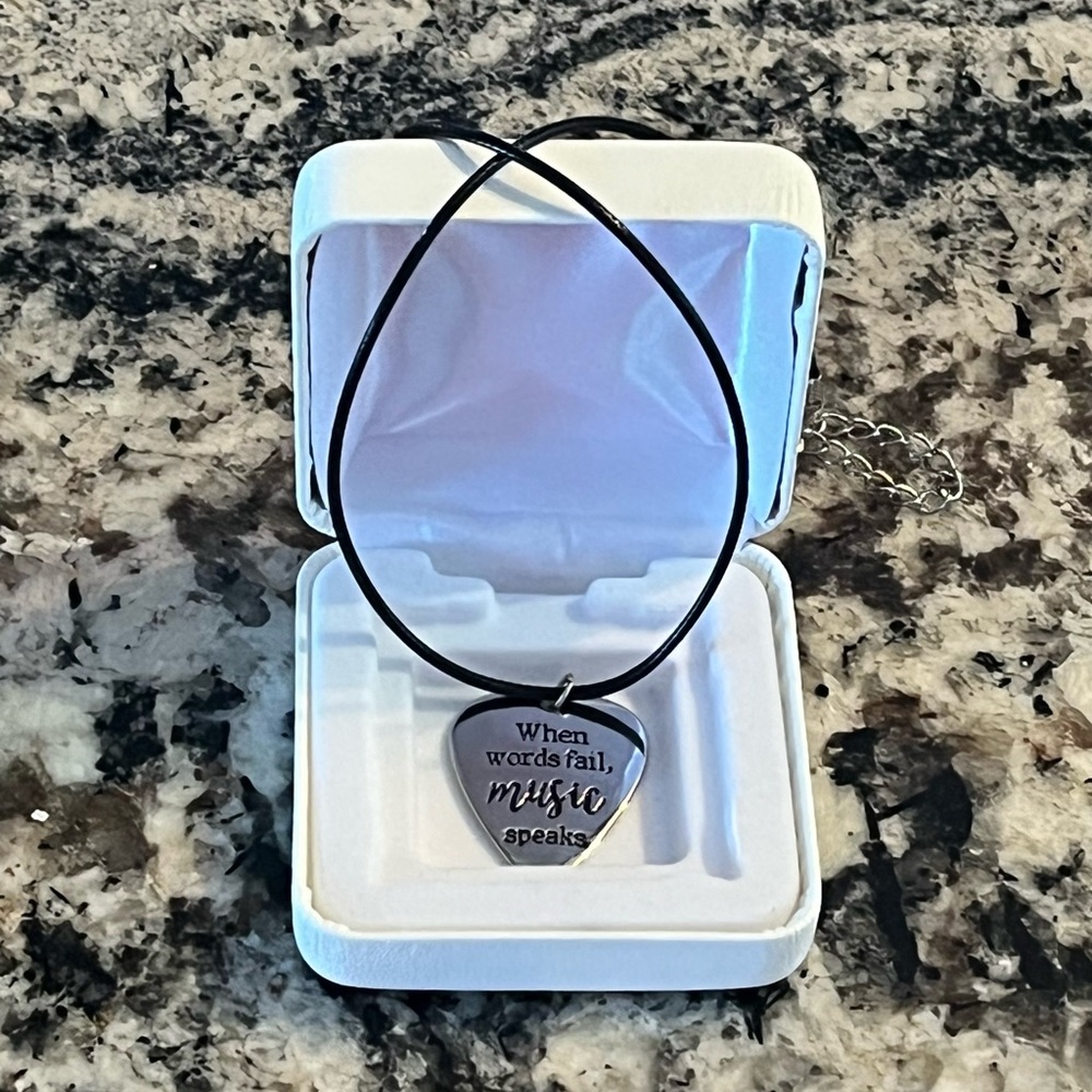 Inspirational Silver Music Guitar Pick Necklace on black leather cord. New.
